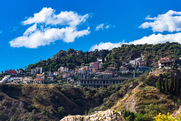 Fototapeta na wymiar View from Letojanni to Taormina. Letojanni nestled to the north of Taormina, Letojanni is a popular coastal resort. Sicily, Italy.
