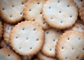 Tasty crackers close up in the box. Cookies background