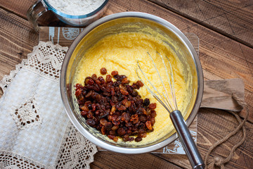 Step-by-step preparation of a raisin cake - mixing the necessary ingredients, top view