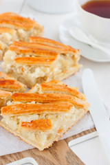 Traditional for the kitchen Moldovan pie with potatoes and feta cheese, selective focus