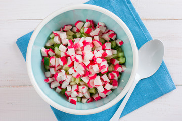 Step by step cooking salad with crab sticks, corn and rice - step - 1 adding crab sticks, top view © Анна Журавлева