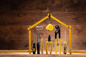 House Made Up Of Measuring Tape Over Tools