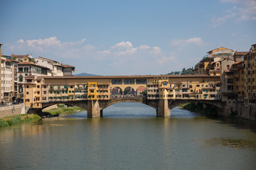 Fototapeta premium The beautiful Ponte Vecchio bridge straddling the river Arno in Florence, Italy