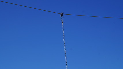 metal carabiner clip bearing with fastening iron chain to the metal wire