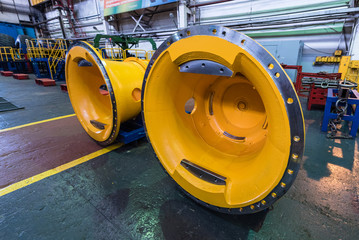 Huge wheels of a yellow dump truck