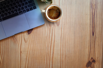 Workspace and copy space. computer and coffee on wooden table.
