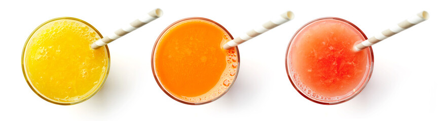 Fresh orange carrot and grapefruit juices isolated on white, from above