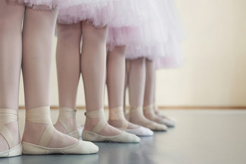 Little dancers legs in pointe shoes, making exercises © Prostock-studio