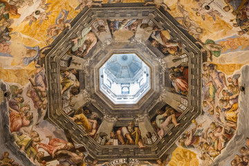 Florence, Italy July 3rd, 2015:  Looking up at the stunning artwork inside the dome of the duomo in Florence, Italy