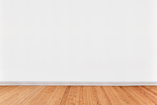 white wall background with wooden floor
