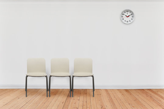 empty waiting room with chairs and clock