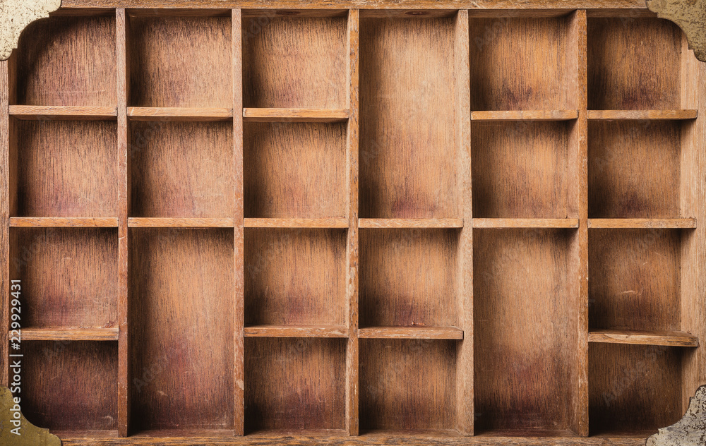 Wall mural Empty wooden box with compartments, top view.