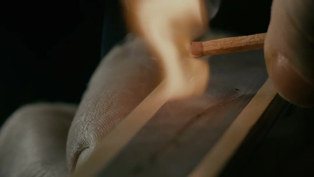 A macro shot of match box over black background.