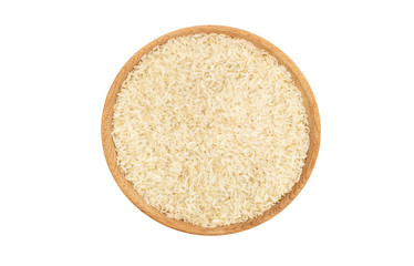 Wooden bowl with raw rice isolated on white. Top view.