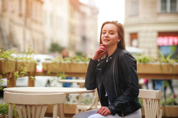 Happy modern sporty teen girl in spring tourist town