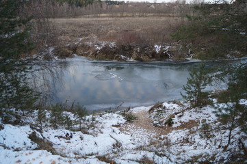 Thin first ice on the river in late autumn and washouts