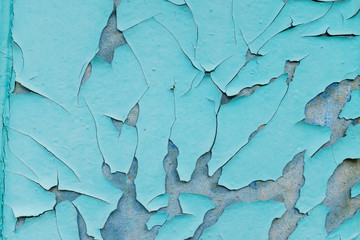 background consisting of old blue green door with peeling paint