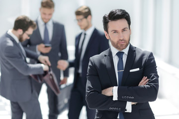 confident businessman standing in the office