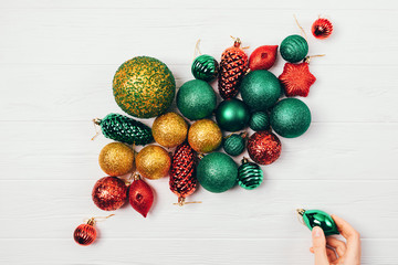 Christmas decorations balls on white table, top view