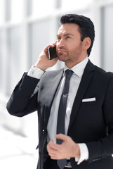 responsible businessman talking on a mobile phone