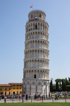 Tourists at the famous leaning tower in Pisa