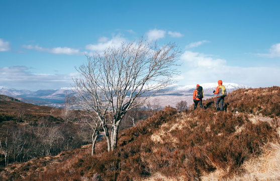 Mountain hikers walks in Highlands, Scotland