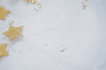 Gold stars are made of wood and painted with gold in color. on the White Blackground.Copy space..