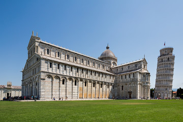 Tourists at the famous Pisa Cathedral, a medieval Roman Catholic cathedral  in the Piazza dei Miracoli in Pisa, Italy, located next to the famous leaning tower