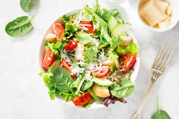 Fototapeten Tasty fresh salad with chicken and vegetables © nerudol