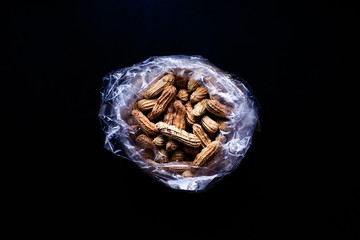 boil nut on black background