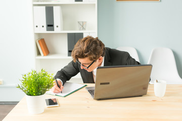 Office, joke and business people concept - young man is fun and enthusiastic working in the office