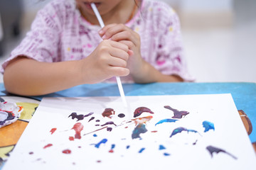 The girl blowing watercolor