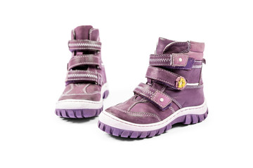 the pink children's sneakers isolated on a white background