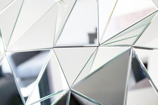 Mirror With Crystals In Wall, Decoration And Reflection. Abstract Glass Background. Polygonal Surface. Close-up. Texture.