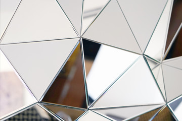 Mirror with crystals in wall, decoration and reflection. Abstract glass background. Polygonal...