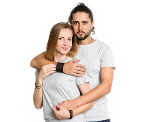 Portrait of happy couple on white background. Couple man and woman hugging and looking at camera.