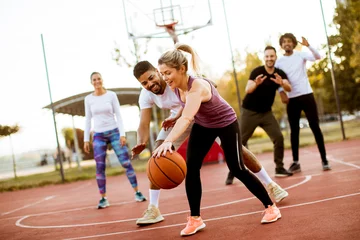 Stoff pro Meter Group of multiracial young people   playing basketball outdoors © BGStock72