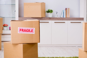 Man moving house and relocating with fragile items