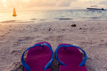 Sandle on beach footwear facing the sunset mauritius dodo
