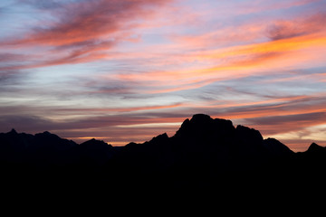 Mountains silhouettes on colorful sunrise