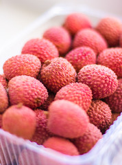 Lychee in plastic box close up