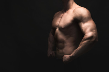 Fototapeta na wymiar Strong athletic man showes naked muscular body