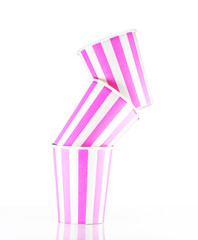 Pink striped paper cups .