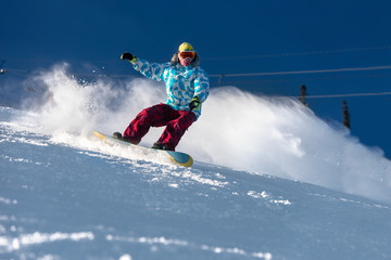 Naklejka na ściany i meble Fast snowboarder ski slope freeride