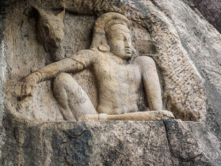 Fototapeta na wymiar The 3rd century B. C. stone carving of man and horse at Isurumuni Rajamaha Viharaya temple in Anuradhapura, Sri Lanka