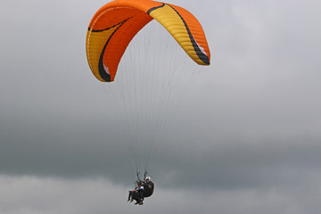 Tandem paraglider flying
