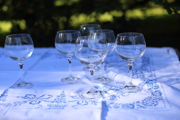 Empty wine glasses on the table outdoors