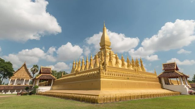 Vientiane Laos time lapse 4K, city skyline timelapse at Wat Phra That Luang Golden Pagoda