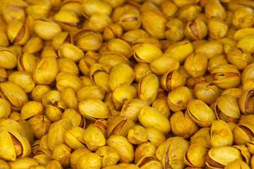 Fried salted pistachios nut food taste delicious beneficial features harvest appetite background
