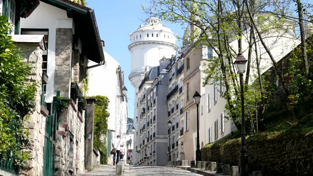Sacre Coeur tourists and beautiful street of Montmartre Paris
